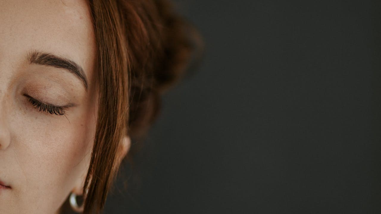Person resting with their eyes closed, looking calm and relaxed
