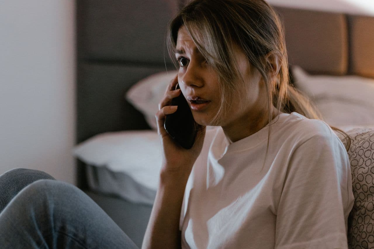 Person making an urgent phone call to their dentist