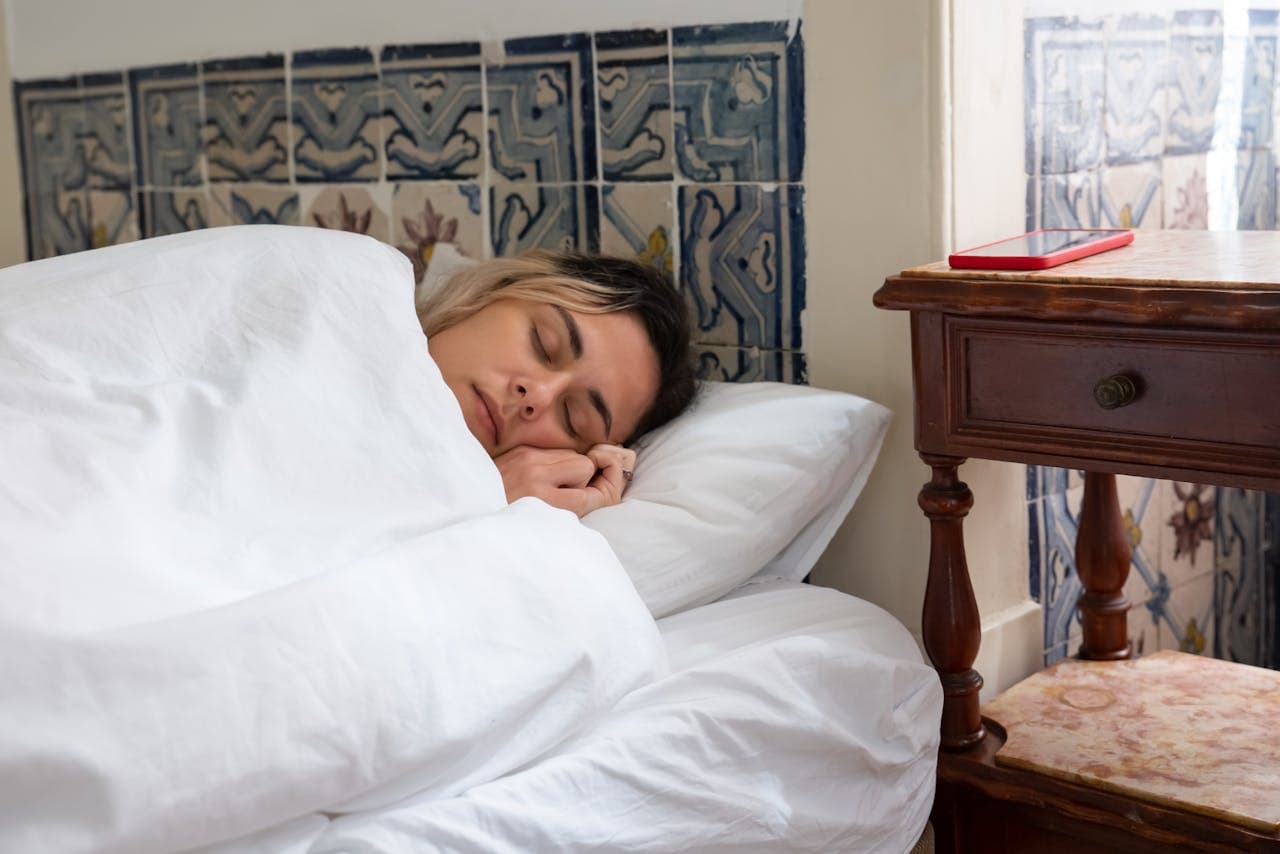 Person sleeping peacefully in bed